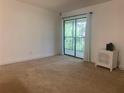 Bright bedroom with access to a private balcony at 6004 Laketree Ln # L, Temple Terrace, FL 33617