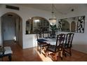 Dining room with arched opening to the kitchen, tile floors, and chandelier at 6218 Palma Del Mar S Blvd # 503, St Petersburg, FL 33715
