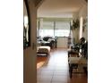 Living room viewed from doorway with tile floors and natural light at 6218 Palma Del Mar S Blvd # 503, St Petersburg, FL 33715
