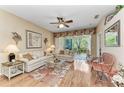 Bright living room with hardwood floors and access to a patio at 6325 Stone River Rd, Bradenton, FL 34203