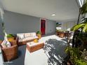 Virtually staged patio furniture on covered patio at 735 Bertrend St, Englewood, FL 34223