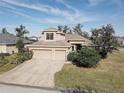 Two-story house with a two-car garage and landscaped lawn at 11405 57Th E St, Parrish, FL 34219