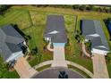 An aerial view showcasing the home's curb appeal and surrounding neighborhood at 13584 Old Creek Ct, Parrish, FL 34219