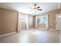 Bright living room with tile floors and ceiling fan at 4202 Las Vegas Dr, New Port Richey, FL 34653