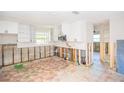 A kitchen undergoing renovation with new white cabinets at 4234 Harrisburg Ne St, St Petersburg, FL 33703