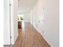 Bright hallway with tile flooring, leading to the kitchen and living areas at 141 Hobo Rd, Rotonda West, FL 33947