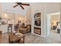 Living room with comfortable seating and built-in entertainment center at 4166 Central Sarasota Pkwy # 521, Sarasota, FL 34238
