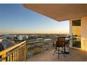Balcony with seating overlooking a cityscape and tennis courts at 450 Knights Run Ave # 1102, Tampa, FL 33602