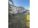 Light-colored house with a covered entryway and landscaping at 10838 87Th Ave, Seminole, FL 33772