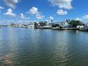 Calm water view with many boats and homes along the canal at 17613 1St E St, Redington Shores, FL 33708