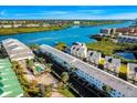 Aerial view of waterfront community with multiple buildings at 19811 Gulf Blvd # 102, Indian Shores, FL 33785