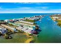 Aerial view of waterfront property, showing building and dock at 19811 Gulf Blvd # 102, Indian Shores, FL 33785
