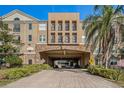 Building exterior with a covered entrance and landscaping at 4221 W Spruce St # 2418, Tampa, FL 33607