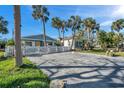 Property view showing a paved driveway and surrounding landscape at 3007 56Th S St, Gulfport, FL 33707