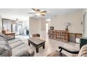 Open living room and kitchen area with brown leather couch at 3007 56Th S St, Gulfport, FL 33707