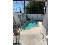 A private backyard oasis featuring a cozy in-ground pool and a charming patio area, perfect for relaxation at 909 Mandalay Ave, Clearwater Beach, FL 33767
