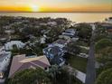 Stunning aerial view showcasing the property, the neighborhood, and the nearby bay at 5004 W Leona St, Tampa, FL 33629