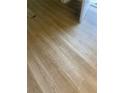 Newly installed light brown wood-look vinyl plank flooring at 670 16Th S Ave, St Petersburg, FL 33701