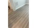Newly installed light brown wood-look vinyl plank flooring at 670 16Th S Ave, St Petersburg, FL 33701