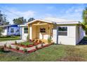 Attractive single-story home boasting a wooden porch and manicured landscaping at 712 E Madison St, Plant City, FL 33563