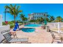 Large and small pools with lounge chairs and hot tub at 12000 Gulf Blvd # 208-S, Treasure Island, FL 33706