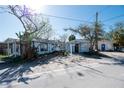 Three houses near the waterfront, one with a for sale sign at 249 Boca Ciega Dr, Madeira Beach, FL 33708
