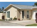 One-story home with attached garage and landscaped front yard at 2740 Highlands Blvd # D, Palm Harbor, FL 34684