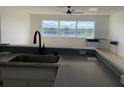 Kitchen with lake view and modern finishes at 3850 13Th N Ave # 312, St Petersburg, FL 33713