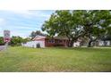 Exterior elevation of the home from the street, highlighting the front yard at 4600 16Th N St, St Petersburg, FL 33703