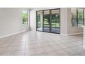 Dining area with tile floors and sliding glass doors leading to a patio at 127 Silver Falls Dr, Apollo Beach, FL 33572