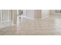Light beige tile flooring throughout the main living area at 127 Silver Falls Dr, Apollo Beach, FL 33572