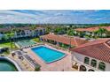 Resort-style pool with surrounding patio and lounge chairs at 19029 Us Highway 19 N # 7-28, Clearwater, FL 33764