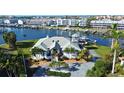 Luxury waterfront home with lush landscaping and boat dock at 224 7Th E St, Tierra Verde, FL 33715