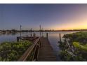 Private dock with string lights, perfect for enjoying waterfront sunsets at 323 Coffee Pot Ne Dr, St Petersburg, FL 33704