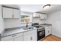 Modern kitchen featuring stainless steel appliances and granite countertops at 3458 17Th S Ave, St Petersburg, FL 33711
