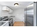 Modern kitchen with stainless steel appliances and light wood flooring at 3458 17Th S Ave, St Petersburg, FL 33711