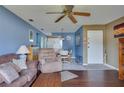 Spacious living area with hardwood floors, comfortable seating and views into the kitchen and dining area at 4215 E Bay Dr # 1704C, Clearwater, FL 33764