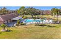 Community pool with surrounding lawn and lounge area at 4920 Locust Ne St # 106, St Petersburg, FL 33703