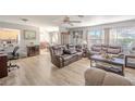 Spacious living room with hardwood floors and comfortable leather furniture at 9022 Ramsgate Dr # 9022, New Port Richey, FL 34655