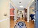 Welcoming entryway with hardwood floors, an area rug, and decorative accents at 10114 Lindelaan Dr, Tampa, FL 33618