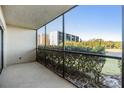 Screened patio with view of lush greenery at 3200 Cove Cay Dr # 1E, Clearwater, FL 33760