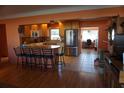 Kitchen with light wood cabinets, granite counters, and breakfast bar at 4464 36Th Ave N N Ave, St Petersburg, FL 33713