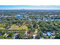 High-angle view of home near park and river with city skyline in background at 609 W Henry Ave, Tampa, FL 33604