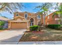 Two-story house with a large yard and attached garage at 10637 Liberty Bell Dr, Tampa, FL 33647