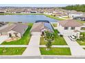 This stunning property boasts a desirable location overlooking a lake, complete with solar panels at 11914 Wild Daffodil Ct, Riverview, FL 33579
