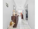 Bright and spacious hallway with tile flooring and decorative accents at 11914 Wild Daffodil Ct, Riverview, FL 33579