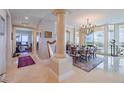 Bright dining room featuring a chandelier and hardwood floors at 140 Riviera Dunes Way # 1001, Palmetto, FL 34221