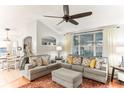 Open living area with two sofas and a view into the dining area at 3022 Beaver Pond Trl, Valrico, FL 33596