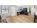 Light and airy living room with hardwood floors and modern decor at 4304 Woodfield Ave, Holiday, FL 34691