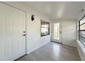 Bright sunroom features wood-look floors and white walls at 5530 Crissman N Dr, St Petersburg, FL 33714